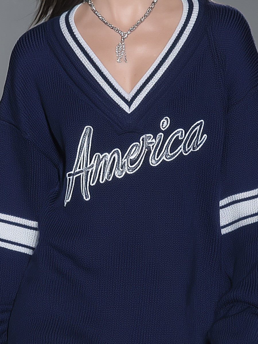 Stylish Blue Knitted Mini Dress With White Embroidery And Contrasting Panels.