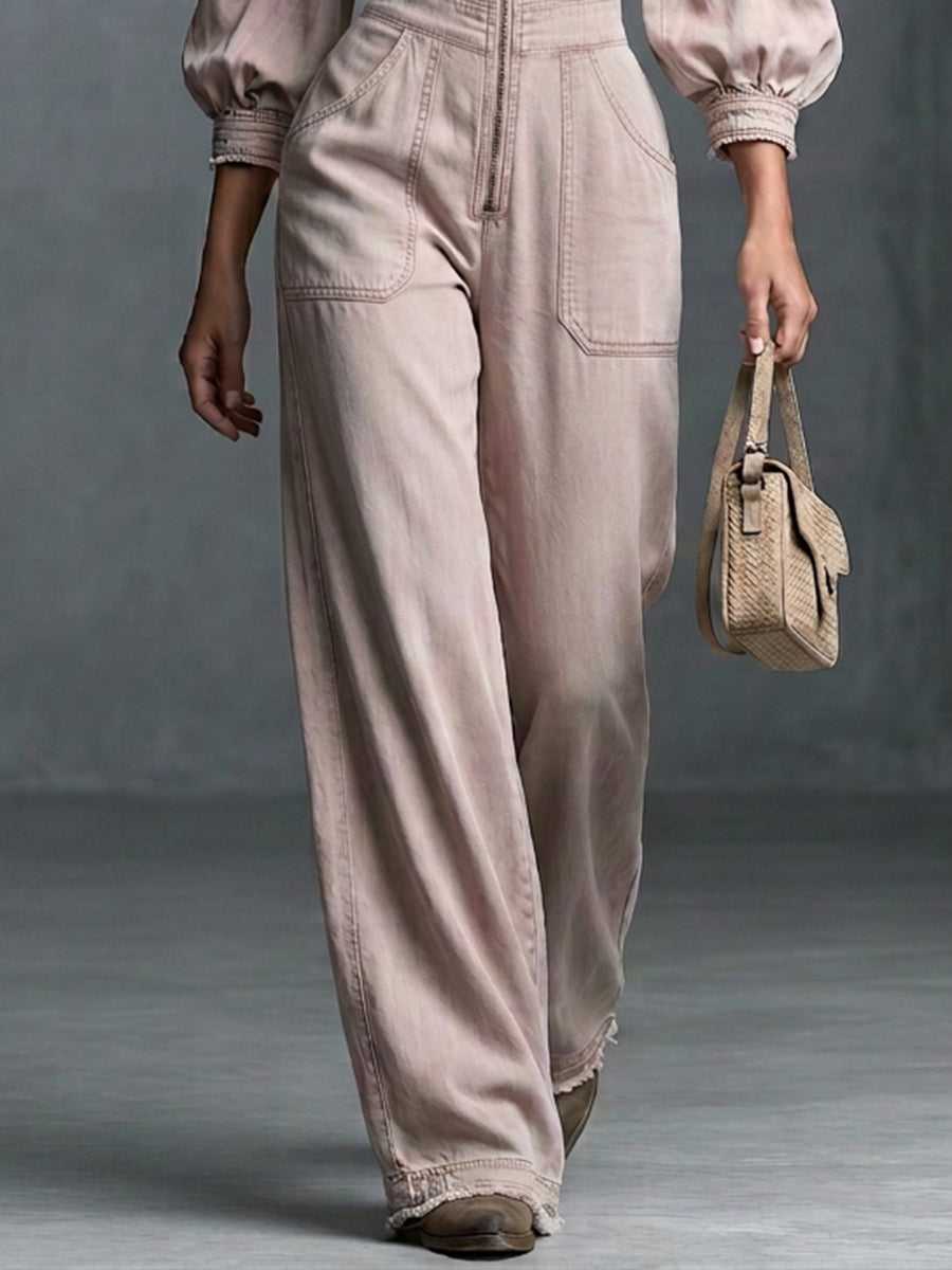 This Washed, Distressed Denim Jumpsuit In A Nude-pink Hue Features A Collared Deep V-neck Off-the-shoulder Design Puff Sleeves And A Front Zipper