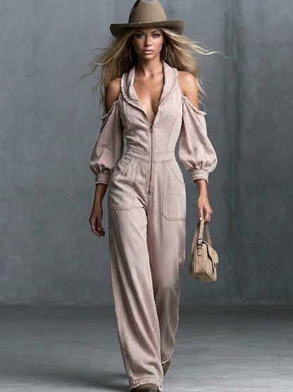 This Washed, Distressed Denim Jumpsuit In A Nude-pink Hue Features A Collared Deep V-neck Off-the-shoulder Design Puff Sleeves And A Front Zipper
